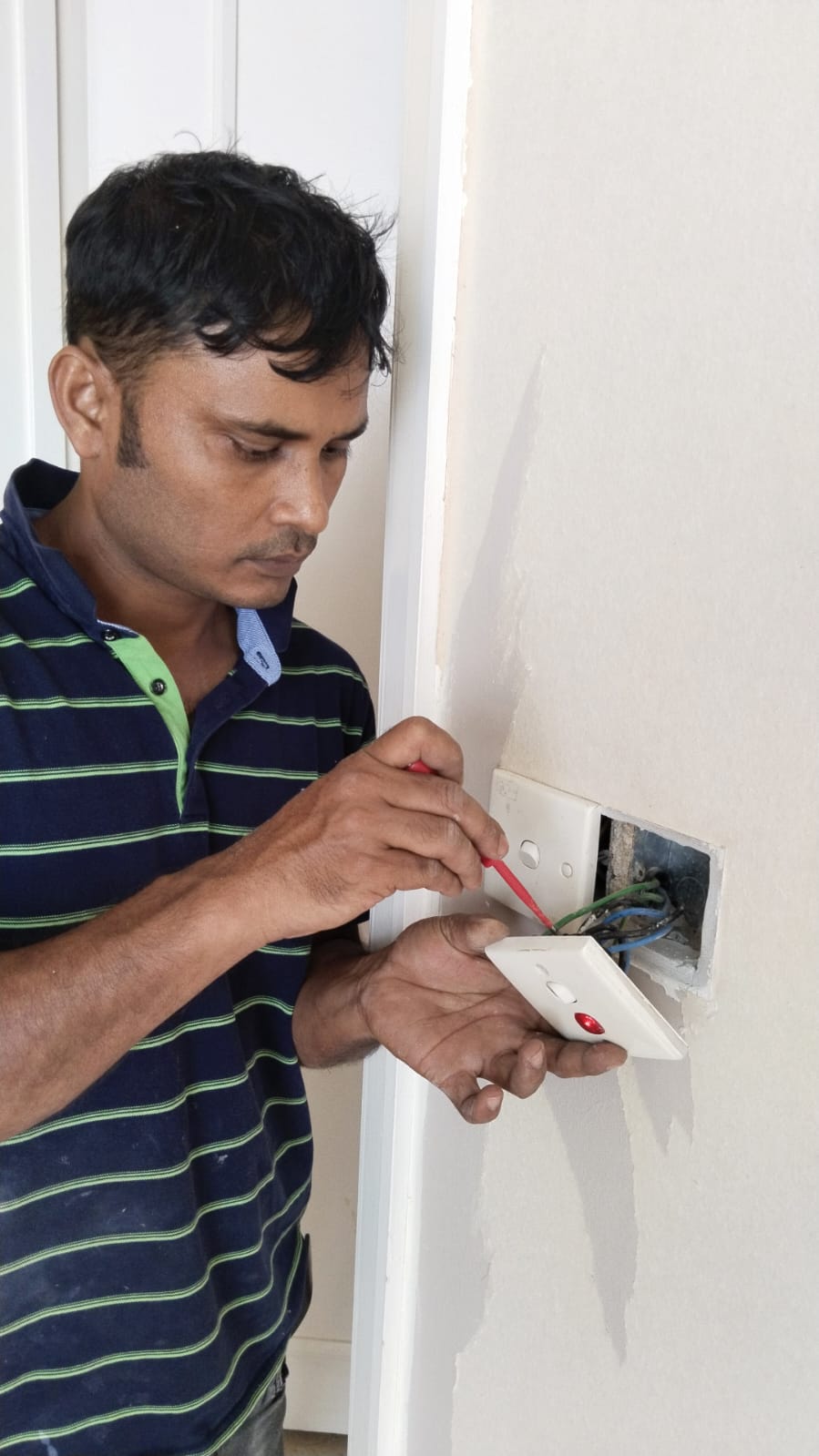 Licensed electrician performing repairs